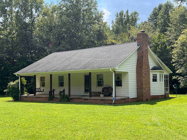 view of front of house with a front lawn and a porch