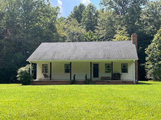 view of front of home featuring a front yard and a porch