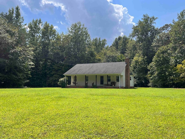 ranch-style house with a front yard and a porch