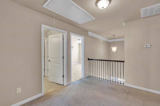 unfurnished room with light colored carpet