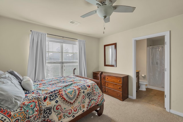 carpeted bedroom with connected bathroom and ceiling fan