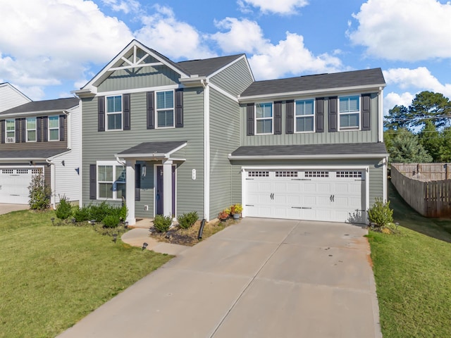 view of front of home with a front lawn and a garage