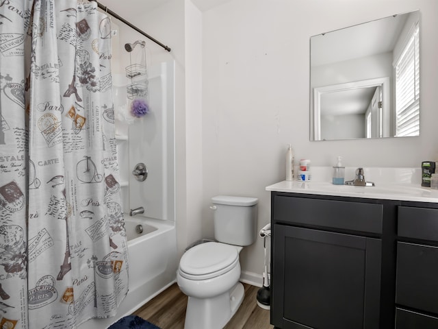 full bathroom with vanity, shower / bath combination with curtain, hardwood / wood-style flooring, and toilet