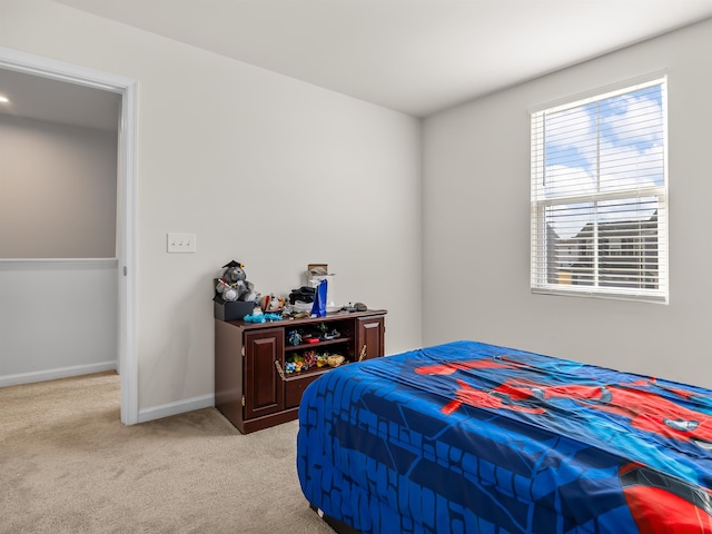 bedroom with light carpet