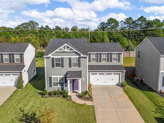 view of front of property with a front lawn and a garage