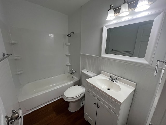 full bathroom featuring vanity, toilet, wood-type flooring, and  shower combination