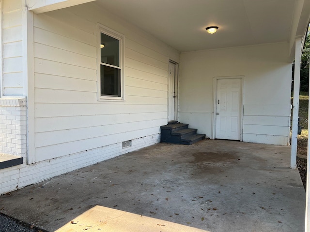 doorway to property with a patio