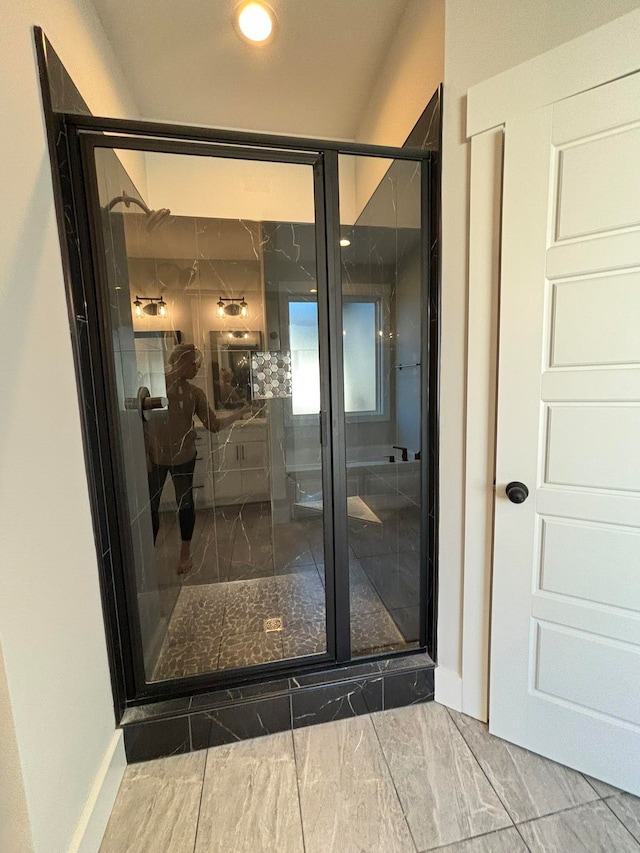 interior space with a shower with shower door