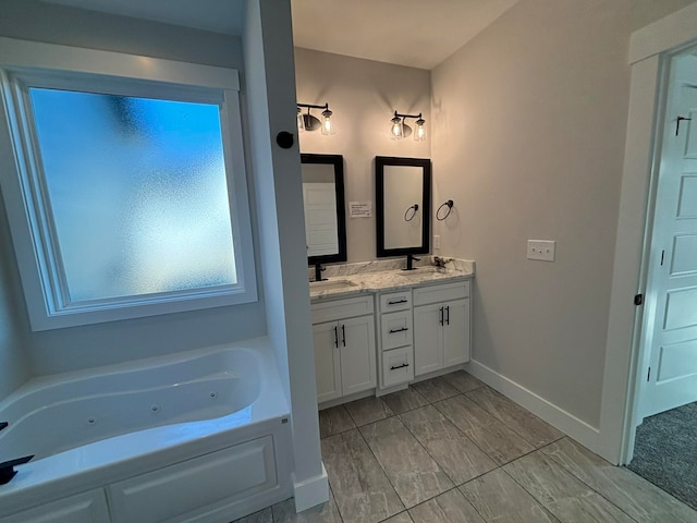 bathroom with vanity and a bath