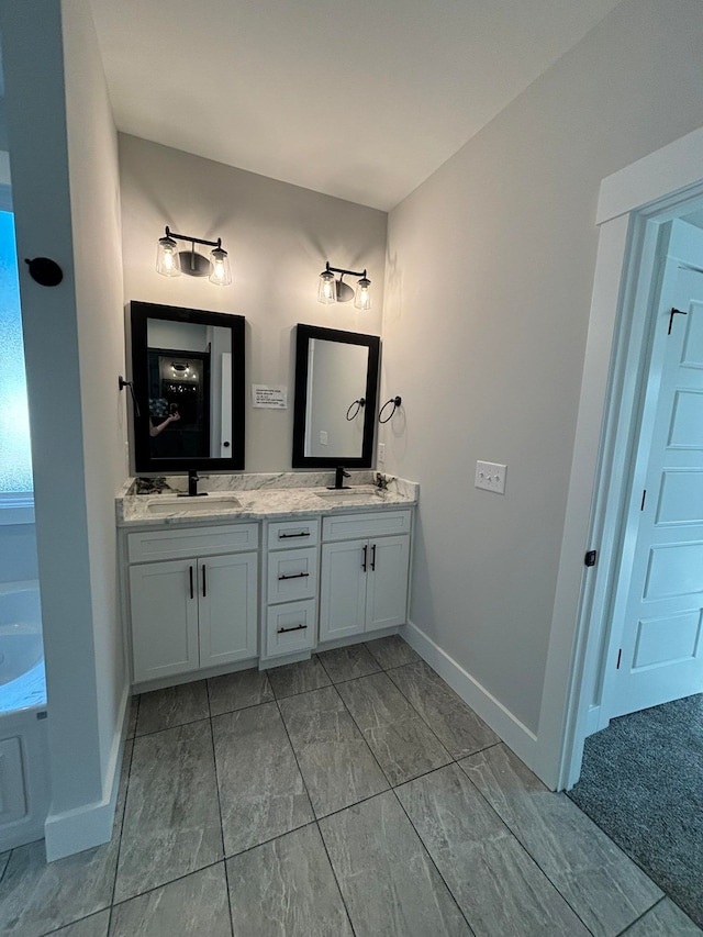 bathroom featuring vanity and a bathing tub