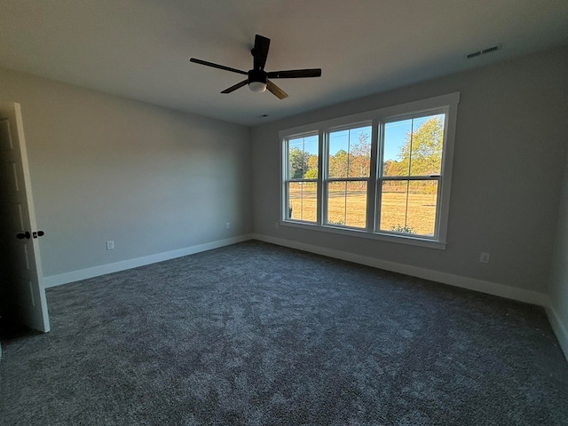 carpeted empty room with ceiling fan