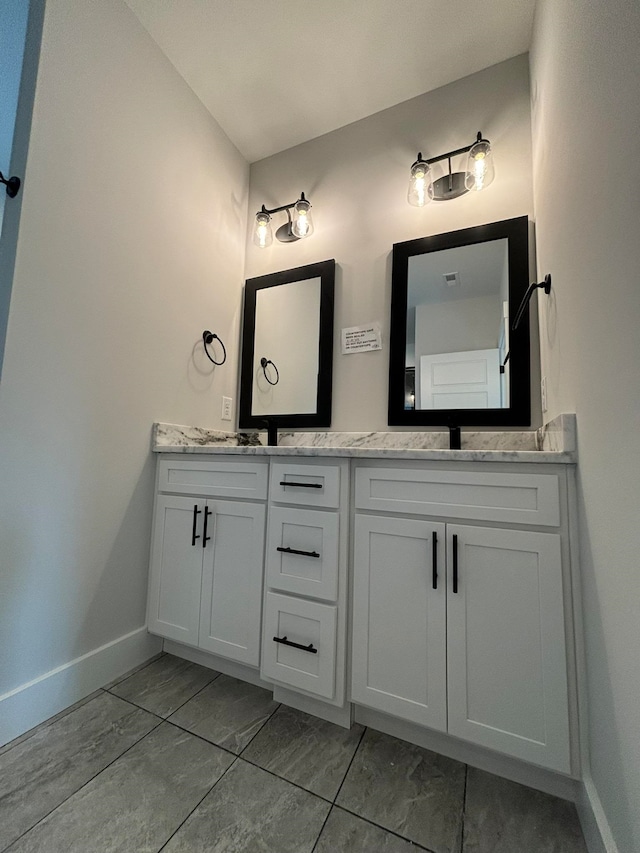 bathroom with vanity and tile patterned flooring