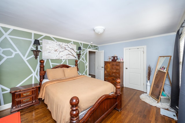 bedroom with ornamental molding and dark hardwood / wood-style floors