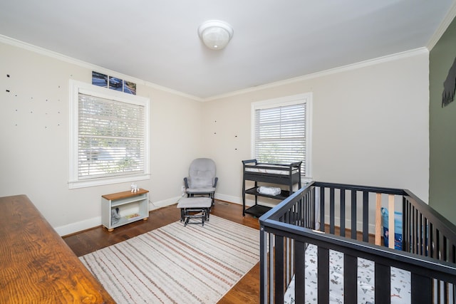 bedroom with dark hardwood / wood-style flooring, multiple windows, and crown molding