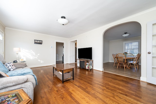 living room with crown molding and dark hardwood / wood-style floors