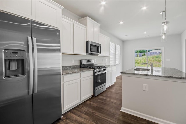 kitchen featuring white cabinets, dark hardwood / wood-style flooring, sink, and stainless steel appliances