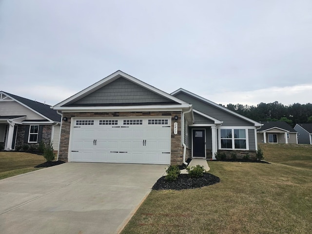 craftsman-style home with a garage and a front lawn