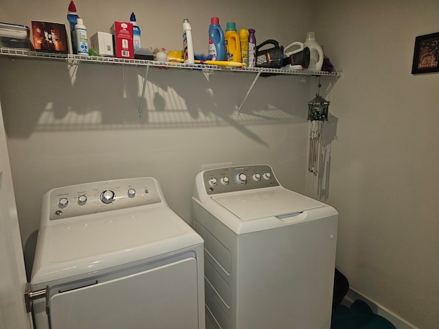 laundry room with independent washer and dryer