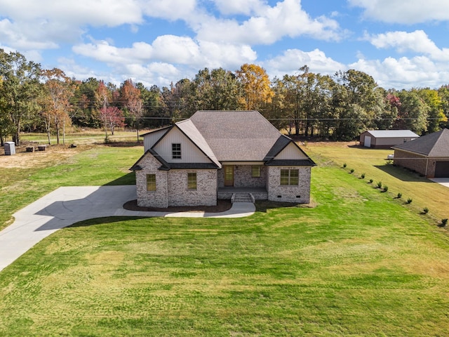 view of front facade with a front yard and a garage