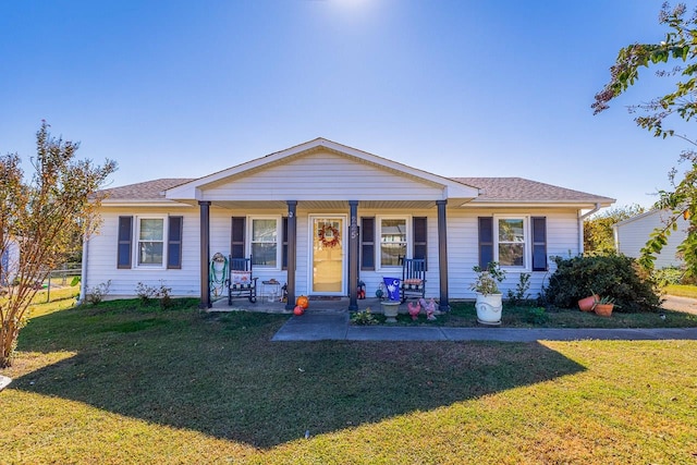 single story home with a front yard and covered porch