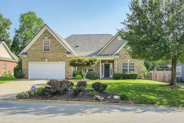 view of front of home featuring a garage and a front lawn