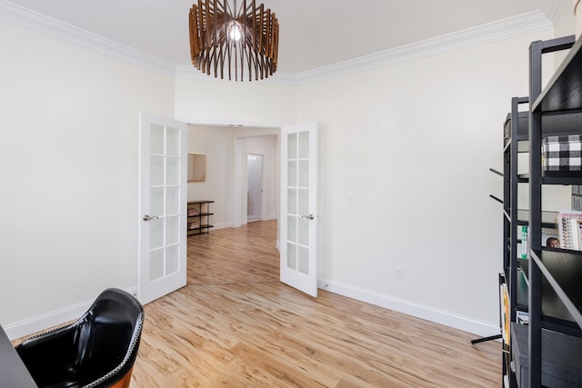 office with french doors, ornamental molding, and light hardwood / wood-style flooring