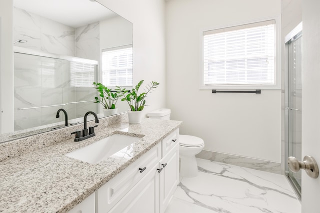 bathroom with vanity, toilet, and an enclosed shower