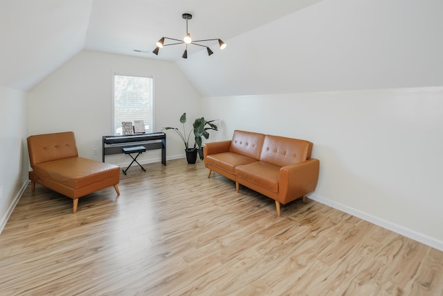 living area featuring light hardwood / wood-style flooring and lofted ceiling