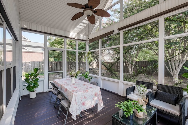 sunroom featuring ceiling fan