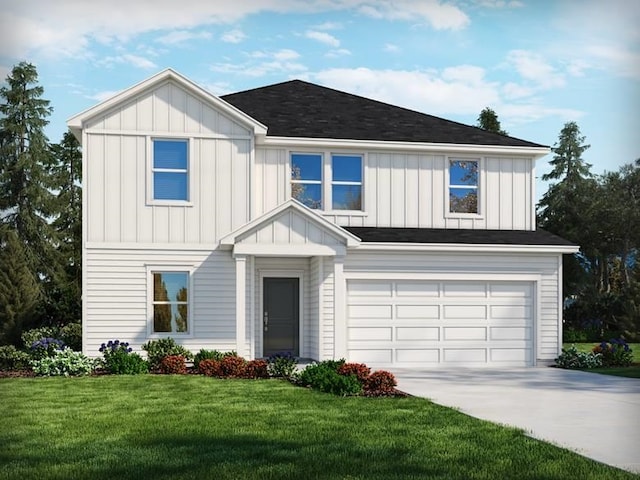 view of front of house featuring a garage and a front lawn