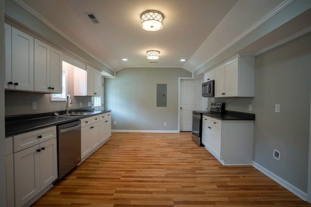 kitchen with sink, white cabinets, stainless steel appliances, and light wood-type flooring