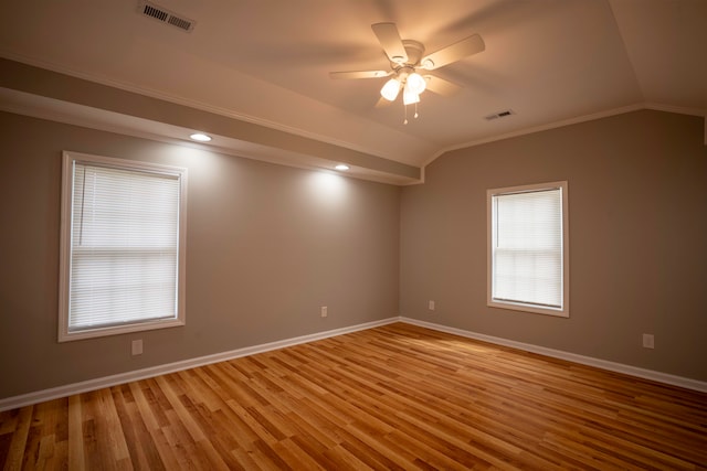 spare room with light hardwood / wood-style floors, lofted ceiling, plenty of natural light, and ceiling fan