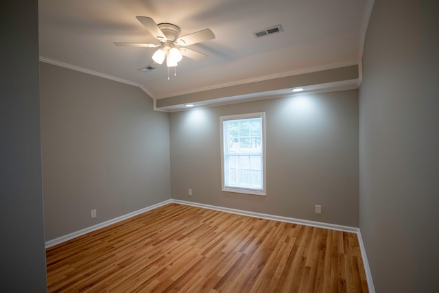 unfurnished room featuring light hardwood / wood-style floors, ornamental molding, and ceiling fan