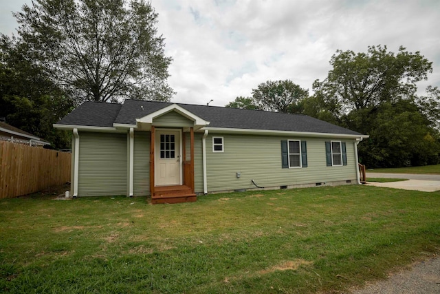 ranch-style house featuring a front lawn