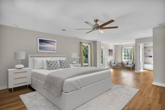 bedroom featuring wood-type flooring and ceiling fan