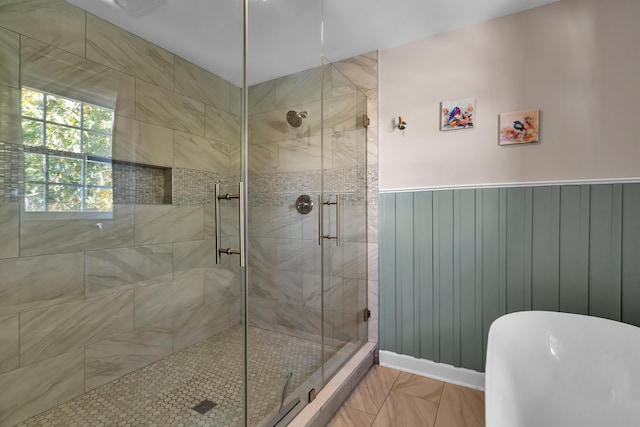 bathroom featuring shower with separate bathtub