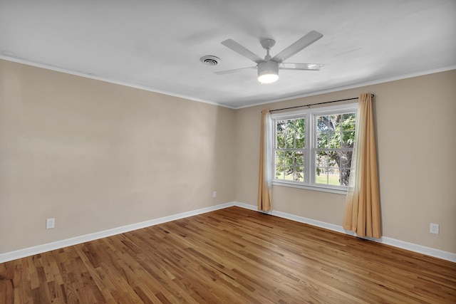 unfurnished room featuring crown molding, light wood-type flooring, and ceiling fan