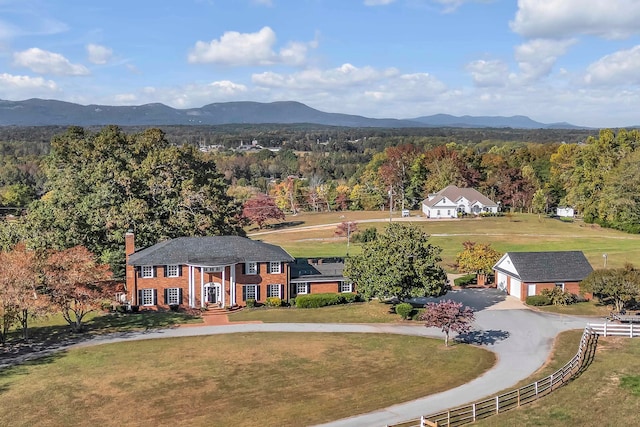 birds eye view of property with a mountain view