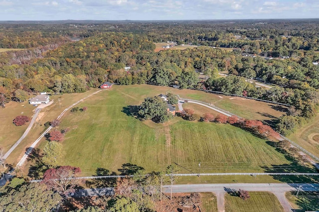 birds eye view of property with a rural view