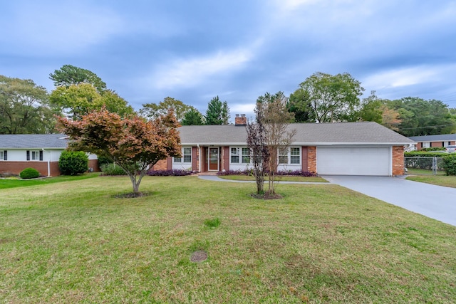 single story home featuring a front lawn and a garage