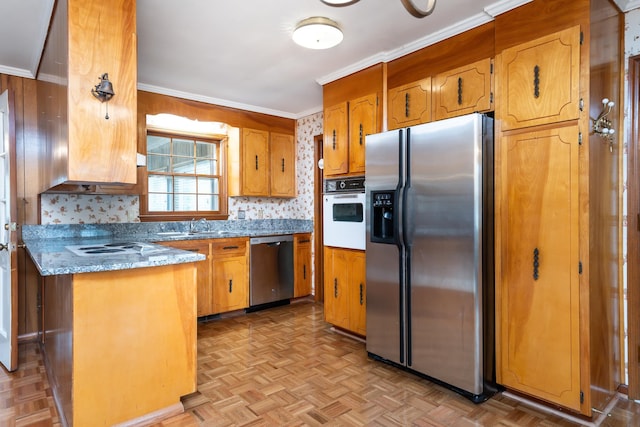 kitchen featuring light parquet floors, appliances with stainless steel finishes, ornamental molding, and backsplash