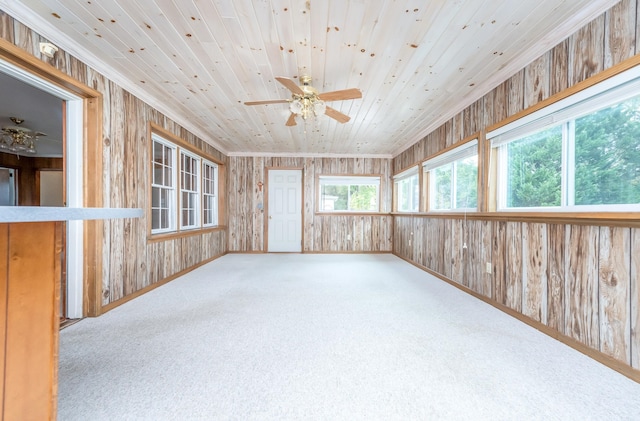 sunroom featuring wood ceiling, plenty of natural light, and ceiling fan