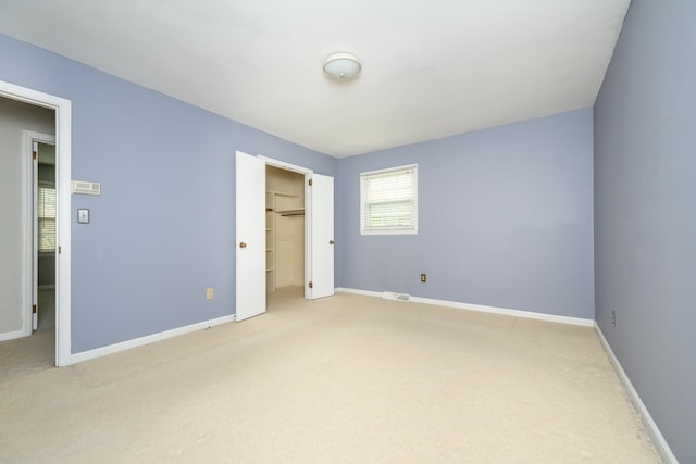 unfurnished bedroom featuring a closet and carpet