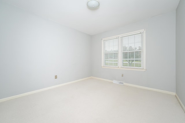 empty room with carpet flooring