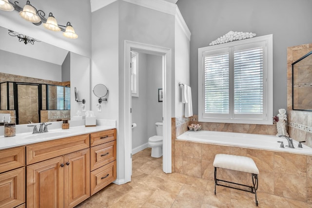 full bathroom featuring plus walk in shower, toilet, vanity, crown molding, and tile patterned flooring