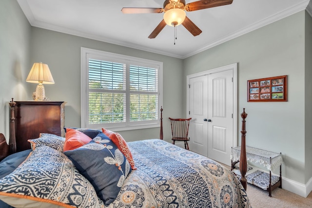 bedroom featuring carpet, a closet, crown molding, and ceiling fan