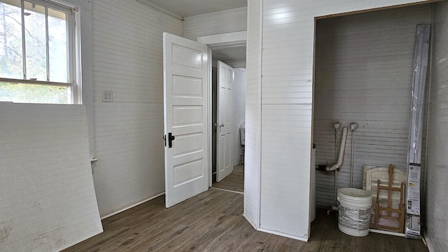 bathroom with a wealth of natural light and hardwood / wood-style flooring