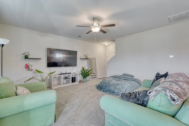 carpeted living room featuring ceiling fan