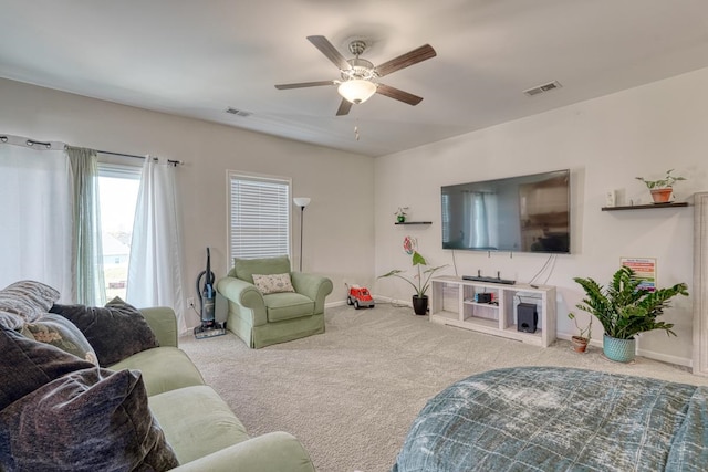 carpeted living room featuring ceiling fan