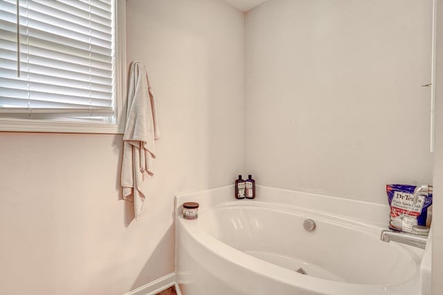 bathroom with a tub